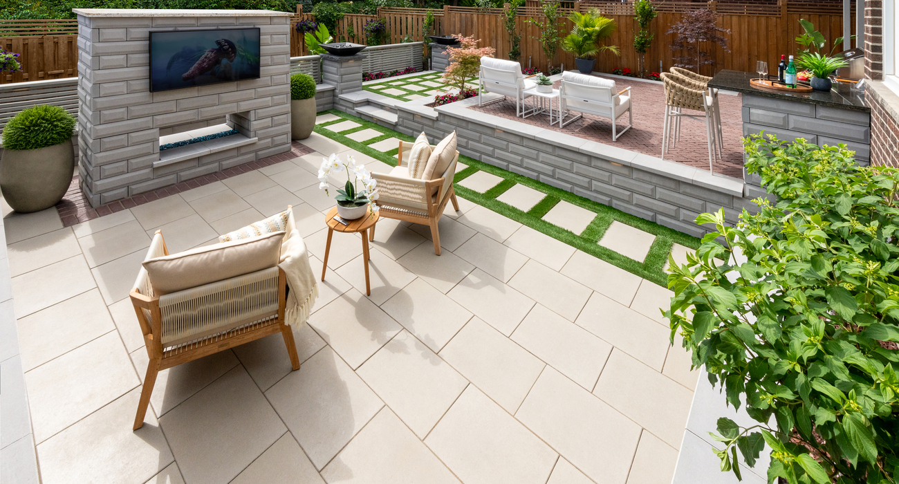 Backyard paver patio with outdoor TV and fire feature